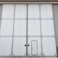 生产销售工业门、生产工业翻板门、工业提升门厂家、工业保温门